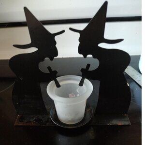 Two watches stir a candle